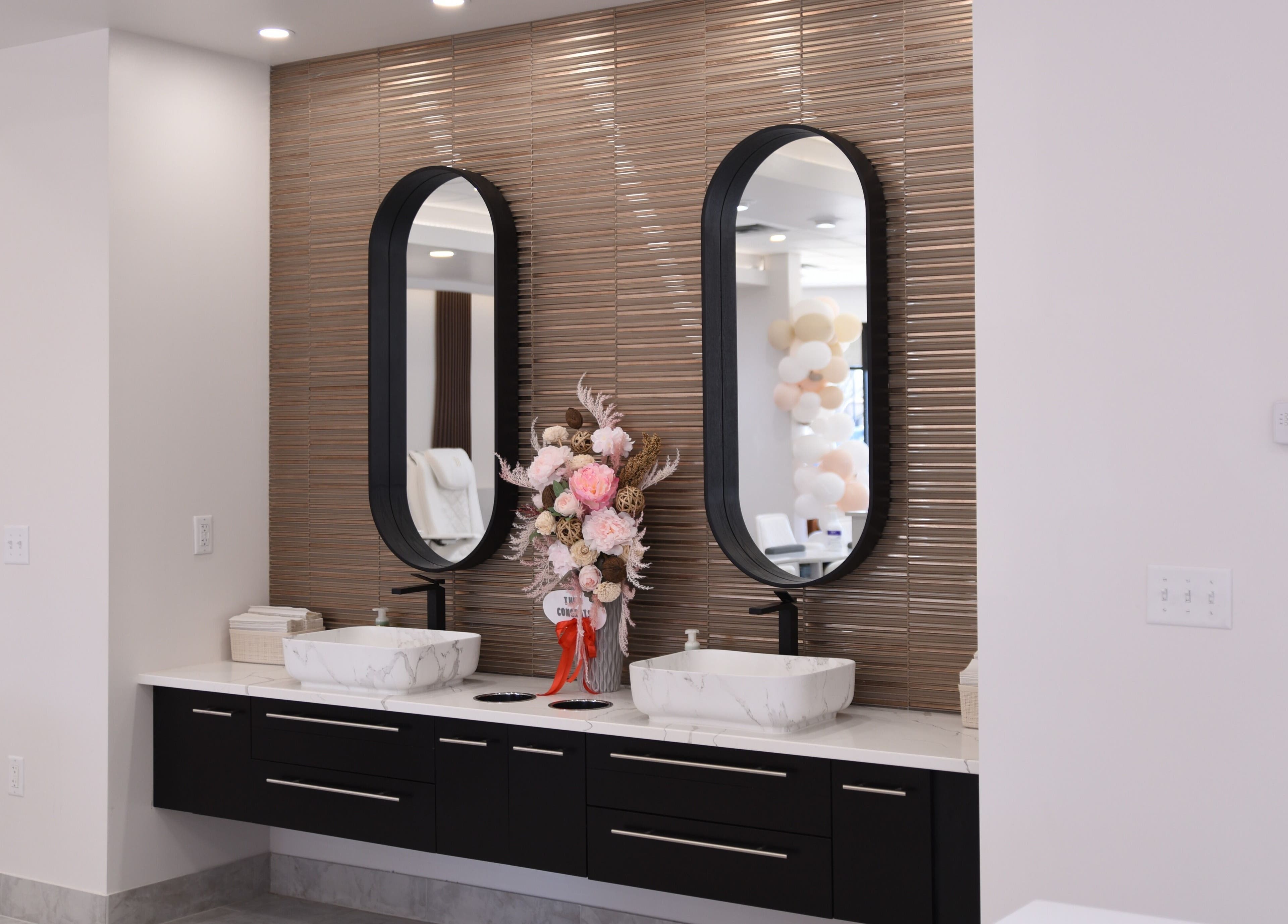 Stylish vanity with dual mirrors at NT Nail Lab, Sauk Rapids, Minnesota, US.