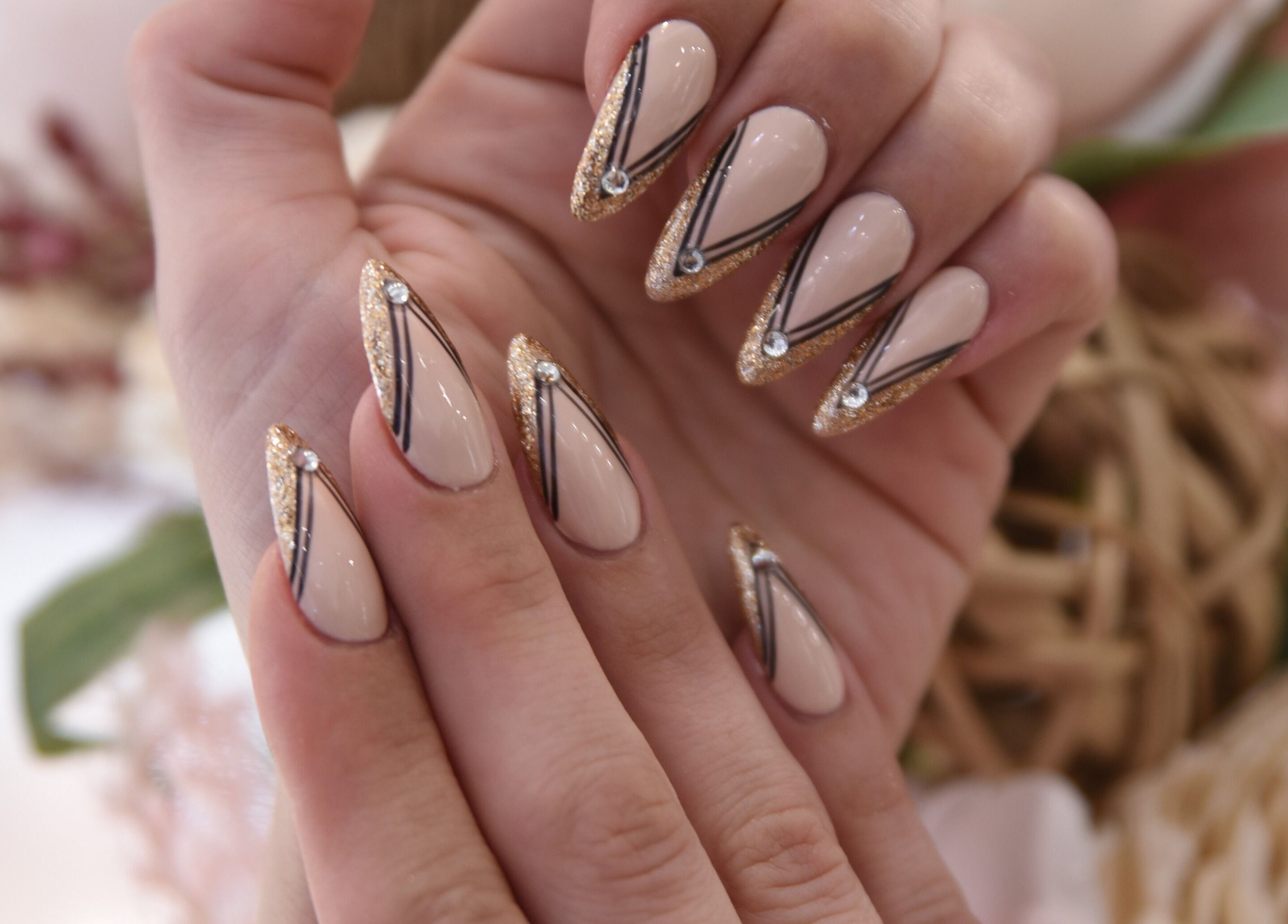 Elegant nail art with gold and black accents at NT Nail Lab in Sauk Rapids, Minnesota, US.