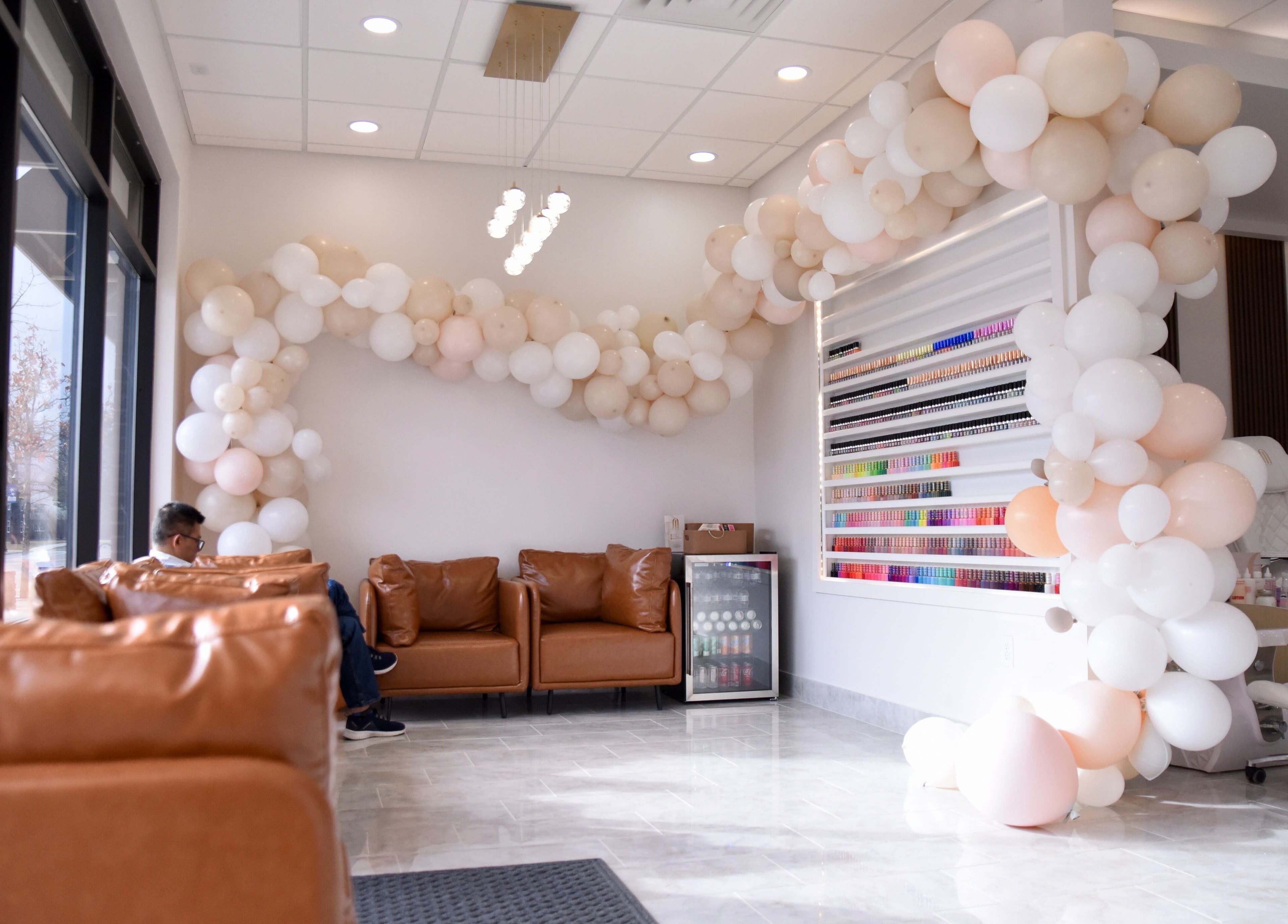 Chic lounge area with balloons at NT Nail Lab in Sauk Rapids, Minnesota, US.