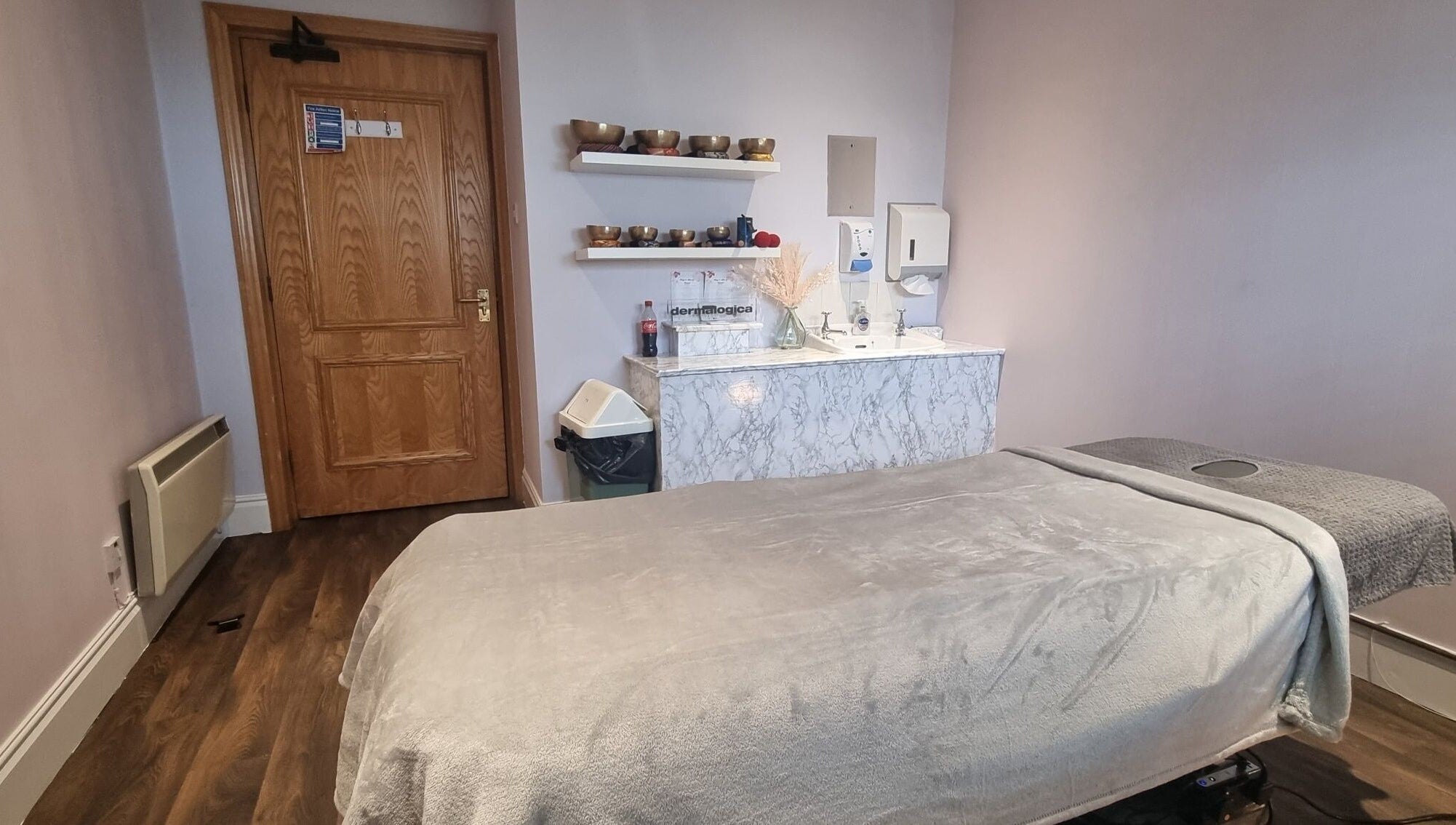 Tranquil massage room at Body & Mind by Hannah, Douglas, Douglas, IM with cozy massage bed and wooden decor.