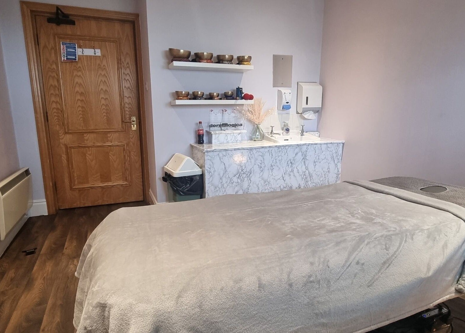 Tranquil massage room at Body & Mind by Hannah, Douglas, Douglas, IM with cozy massage bed and wooden decor.