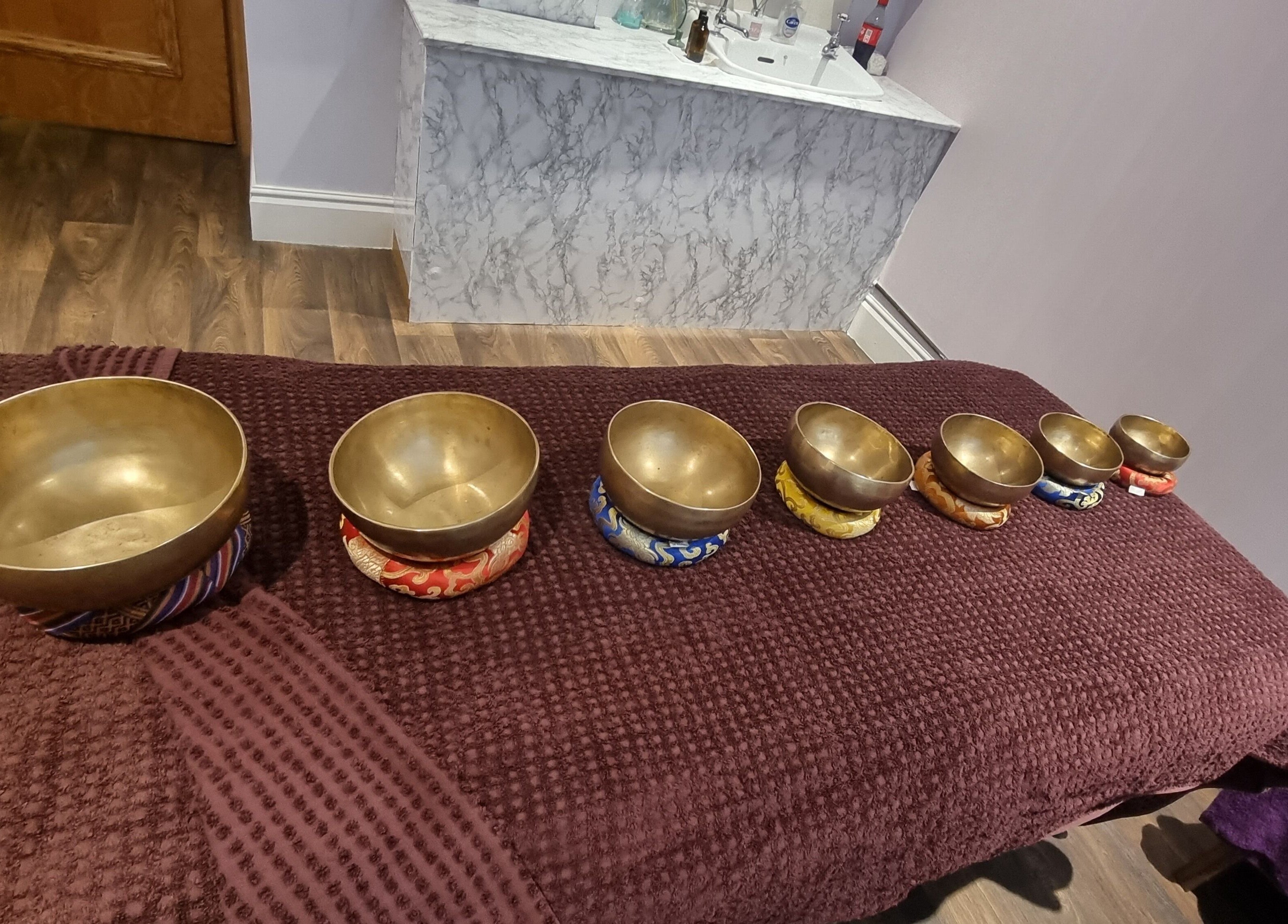 Tibetan singing bowls at Body & Mind by Hannah, Douglas, Douglas, IM, promoting relaxation and harmony.