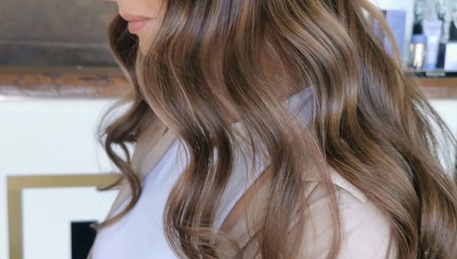 Glossy brown waves styled at Colour by Laura in Belfast, Northern Ireland, GB.