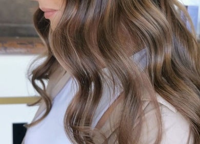 Glossy brown waves styled at Colour by Laura in Belfast, Northern Ireland, GB.