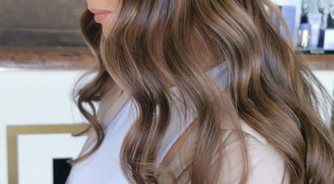 Glossy brown waves styled at Colour by Laura in Belfast, Northern Ireland, GB.