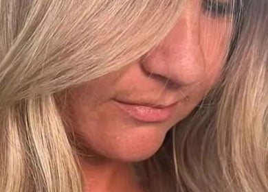 Close-up of blonde hairstyle by Colour by Laura, Belfast, Northern Ireland, GB, showcasing elegant waves.