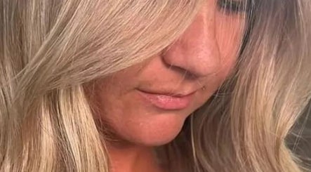 Close-up of blonde hairstyle by Colour by Laura, Belfast, Northern Ireland, GB, showcasing elegant waves.