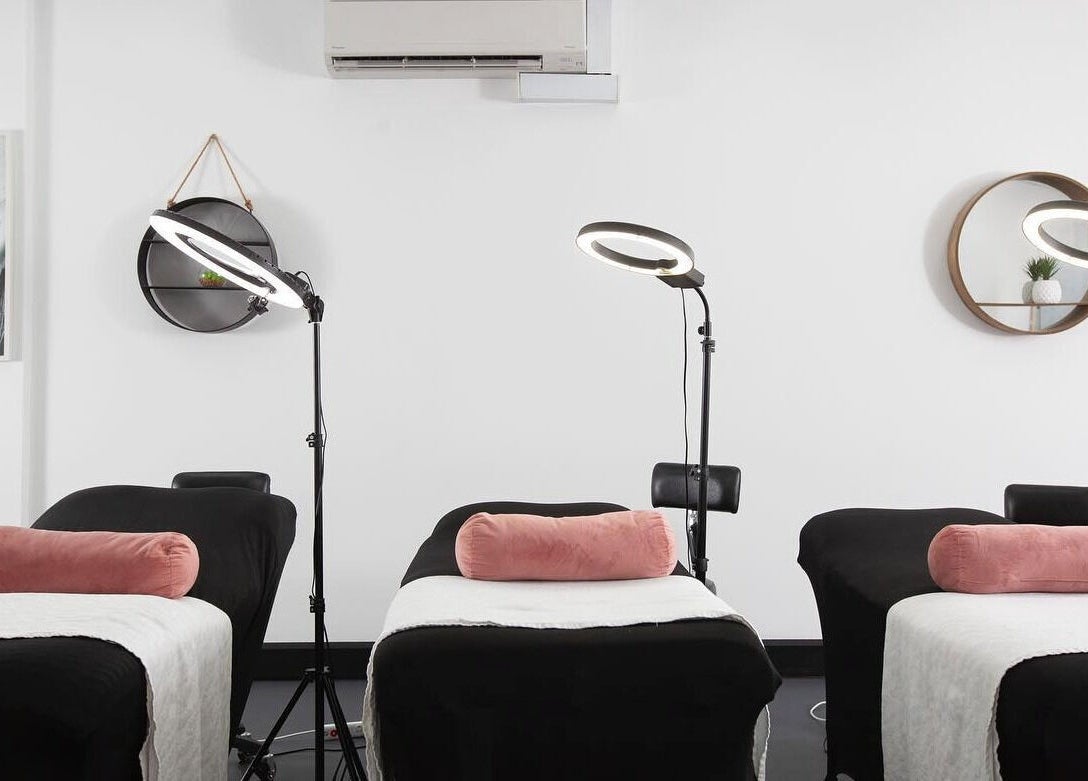 Treatment room at Sydney Teeth Whitening in Botany, New South Wales, AU with sleek black beds and modern decor.