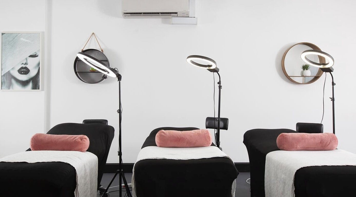 Treatment room at Sydney Teeth Whitening in Botany, New South Wales, AU with sleek black beds and modern decor.