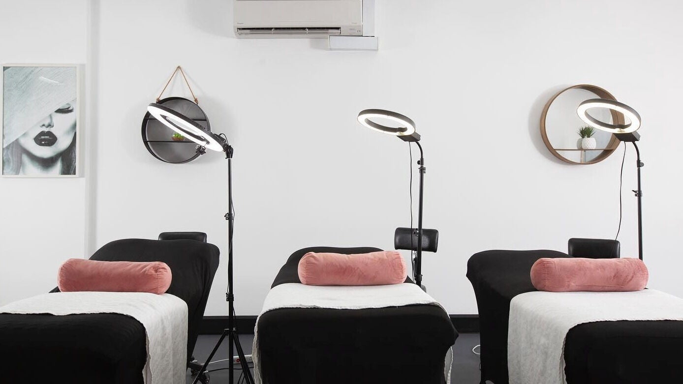 Treatment room at Sydney Teeth Whitening in Botany, New South Wales, AU with sleek black beds and modern decor.