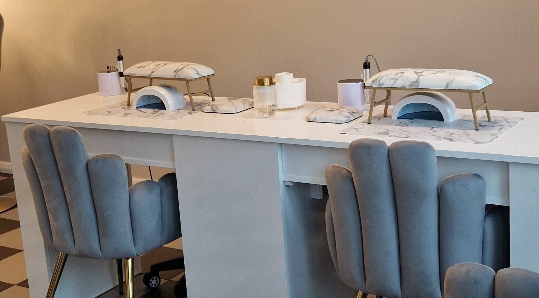 Elegant nail station at Radiant Beauty Glasson, Athlone, County Westmeath, IE with plush chairs and marble accents.
