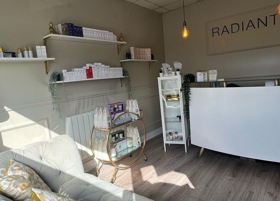 Reception area of Radiant Beauty Kiltoom, relocating January 2026 to Blyry Athlone. Chic decor and product shelves.