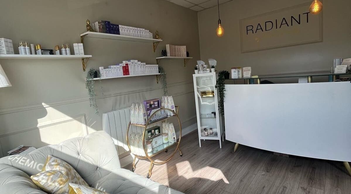 Reception area of Radiant Beauty Kiltoom, relocating January 2026 to Blyry Athlone. Chic decor and product shelves.