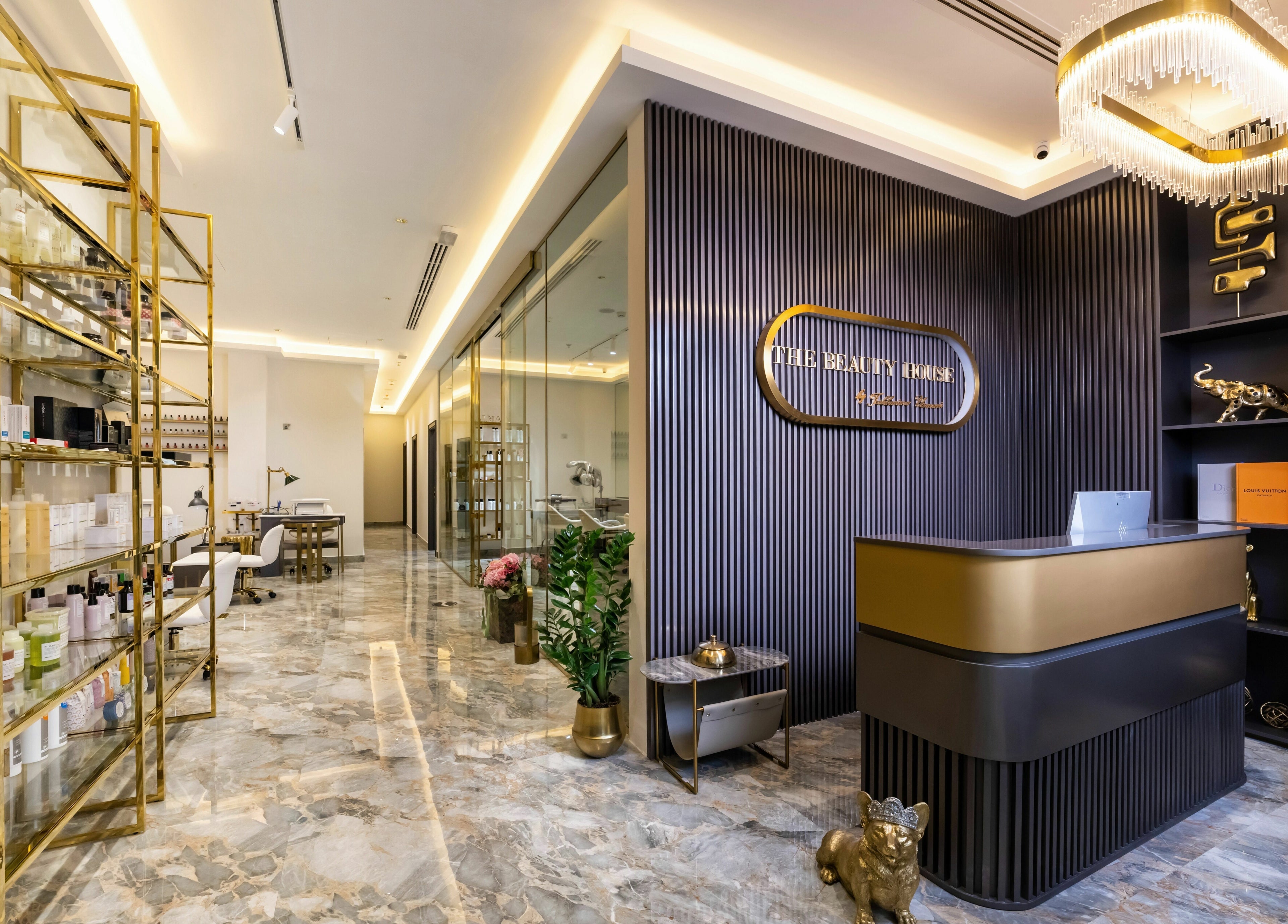 Chic lobby of The Beauty House by Takhmina Usmani, Dubai, AE with modern decor and display shelves.