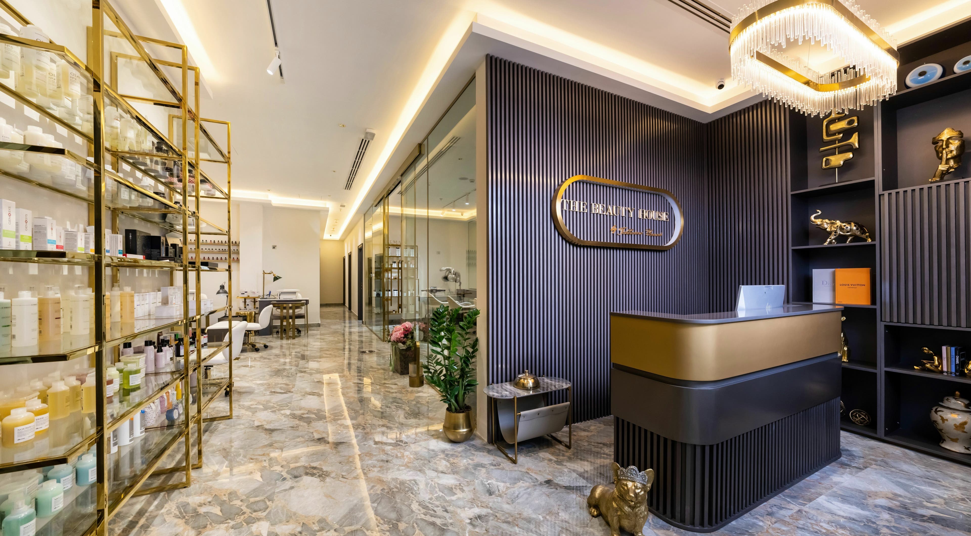 Chic lobby of The Beauty House by Takhmina Usmani, Dubai, AE with modern decor and display shelves.