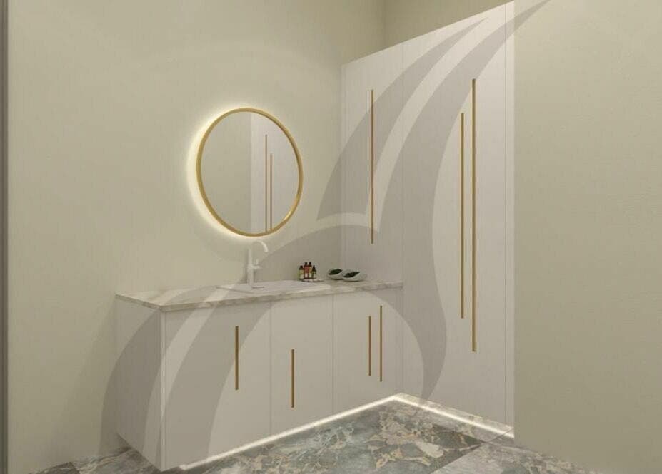 Elegant vanity setup at The Beauty House by Takhmina Usmani, Dubai, AE, featuring a circular mirror and sleek decor.