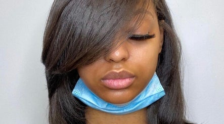 Sleek hair and long lashes by Hair by Rose in Pretoria, Gauteng, ZA, showcasing expert styling.