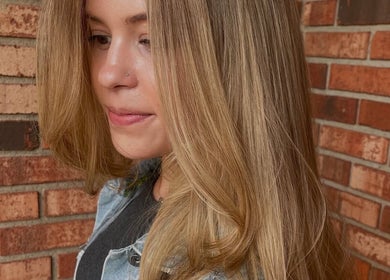 Woman with styled blonde hair at The Salon and Spa at Randolph LLC, Randolph, New Jersey, US.