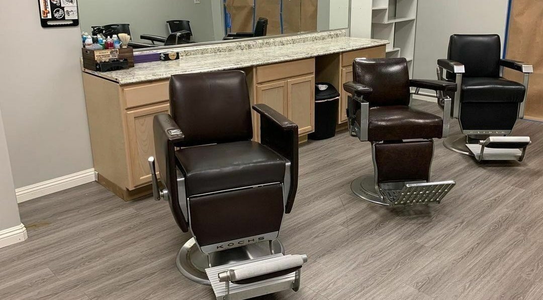 Stylish barber chairs at The Firm Barbershop in Arcadia, California, US, offering a chic grooming experience.