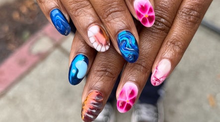 Vibrant nail art at Bicolor Los Feliz, Los Angeles, California, US, featuring colorful, artistic designs.
