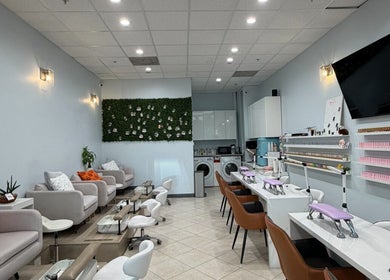 Interior of Bicolor Beverly Hills, a modern salon in Beverly Hills, California, US, with stylish seating and nail stations.