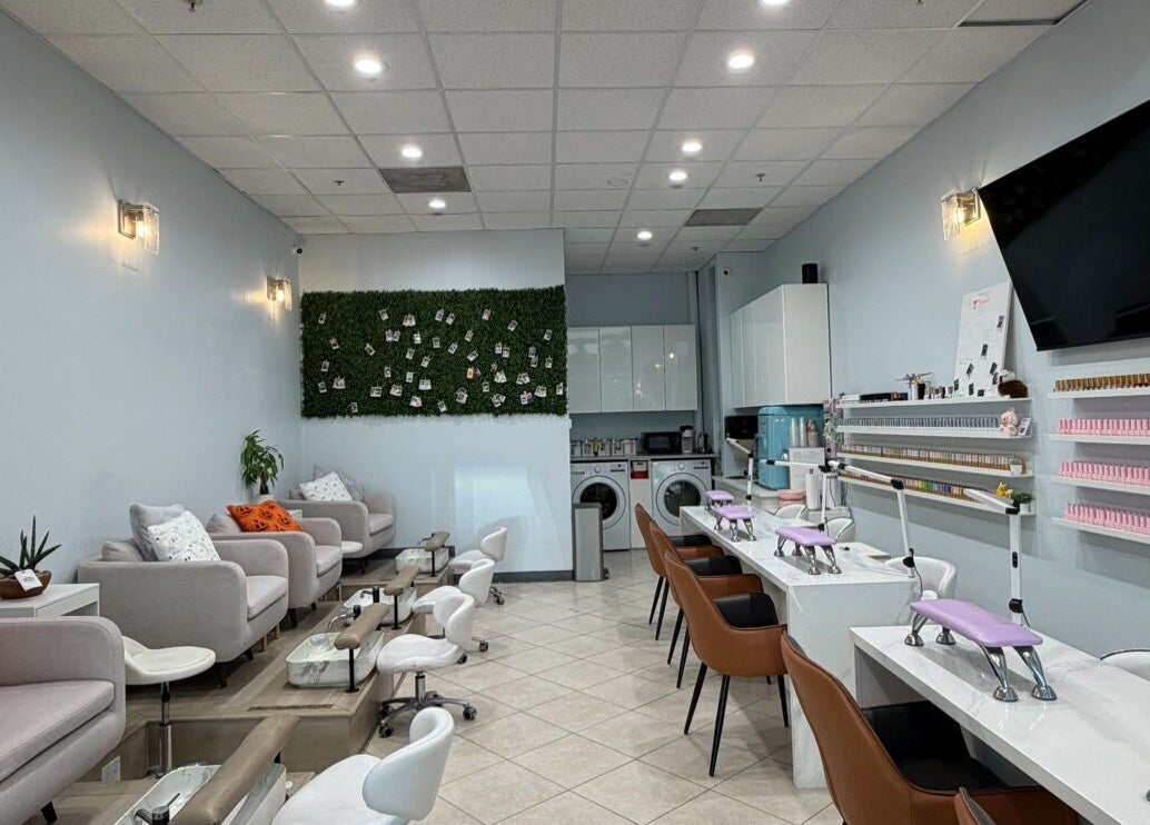 Interior of Bicolor Beverly Hills, a modern salon in Beverly Hills, California, US, with stylish seating and nail stations.