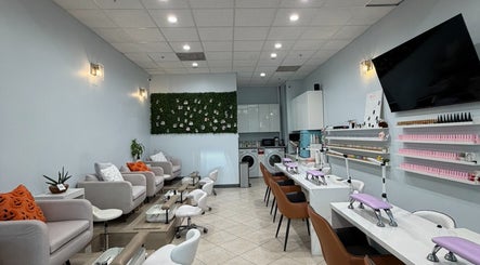 Interior of Bicolor Beverly Hills, a modern salon in Beverly Hills, California, US, with stylish seating and nail stations.