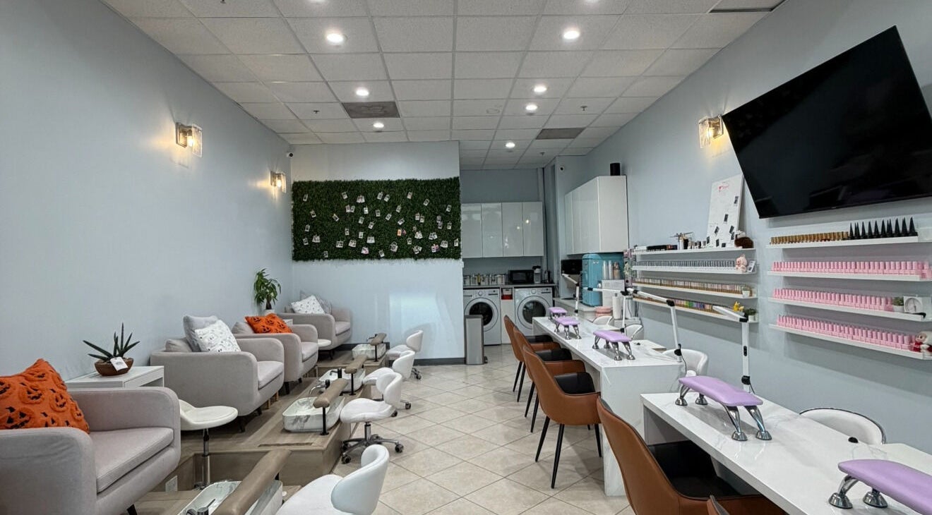 Interior of Bicolor Beverly Hills, a modern salon in Beverly Hills, California, US, with stylish seating and nail stations.