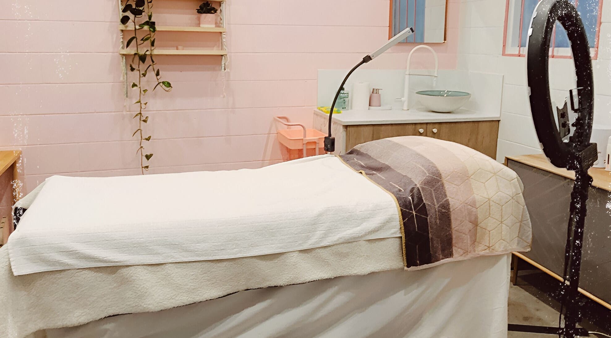 Cozy treatment room at Becky Jayde Cosmetic Artistry in Perth, Western Australia, AU featuring a plush bed.
