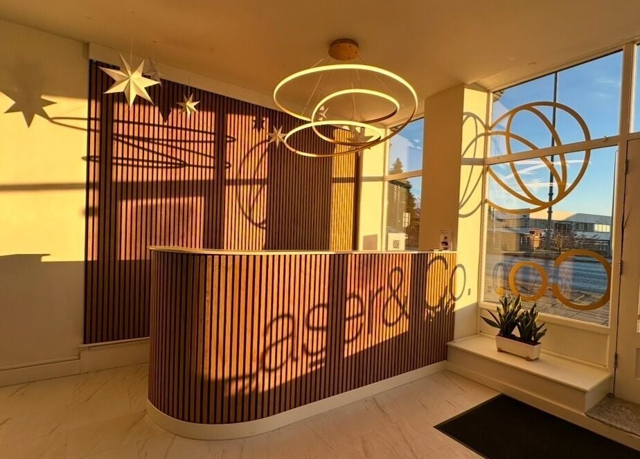 Elegant reception at Laser and Co, Carlisle, England with warm lighting and modern decor.