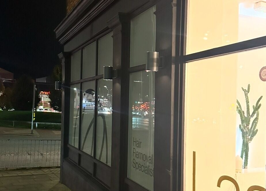 Exterior view of Laser and Co, Carlisle, England, GB under evening lights.