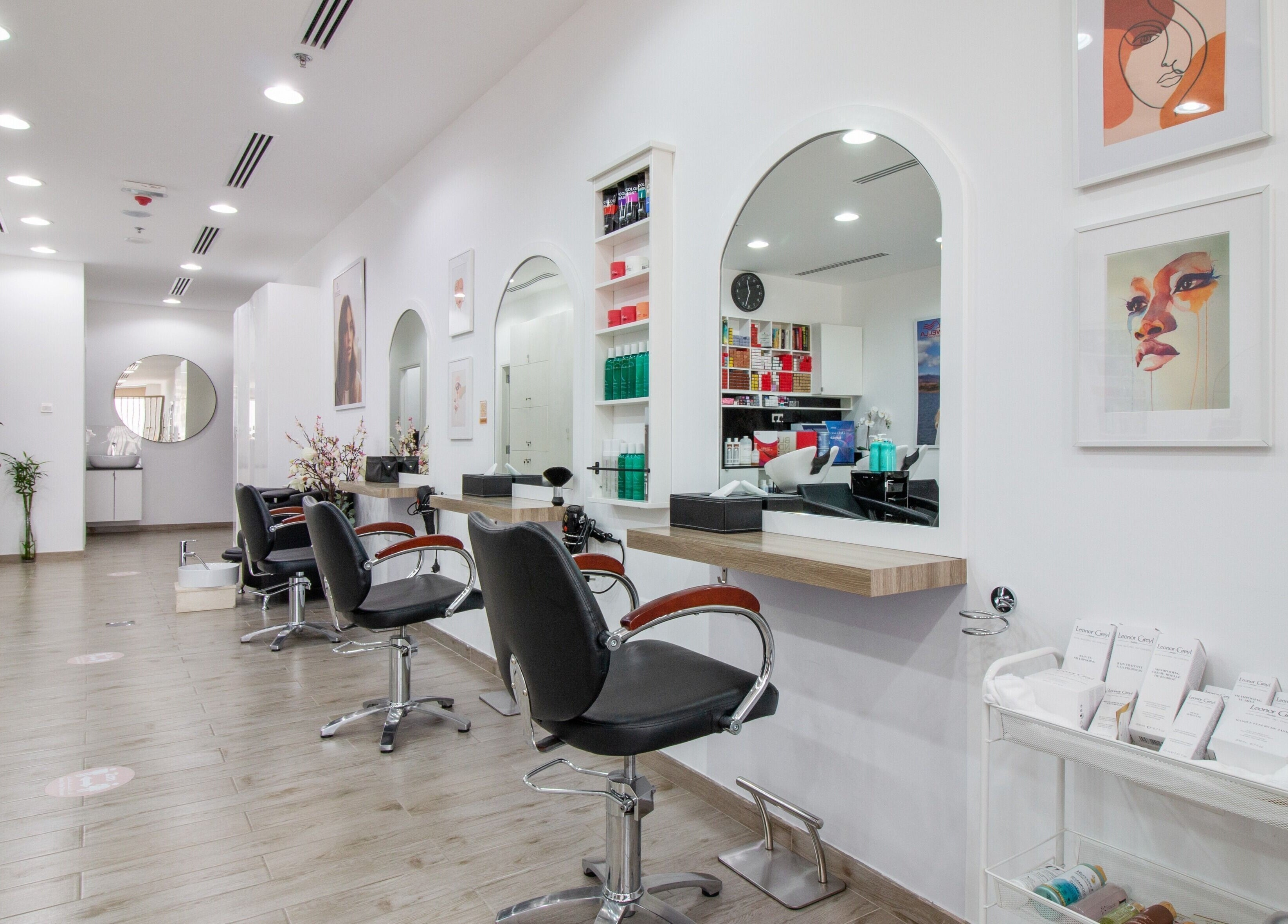 Modern interior of Salon Script in Dubai, AE featuring stylish salon chairs and elegant decor.