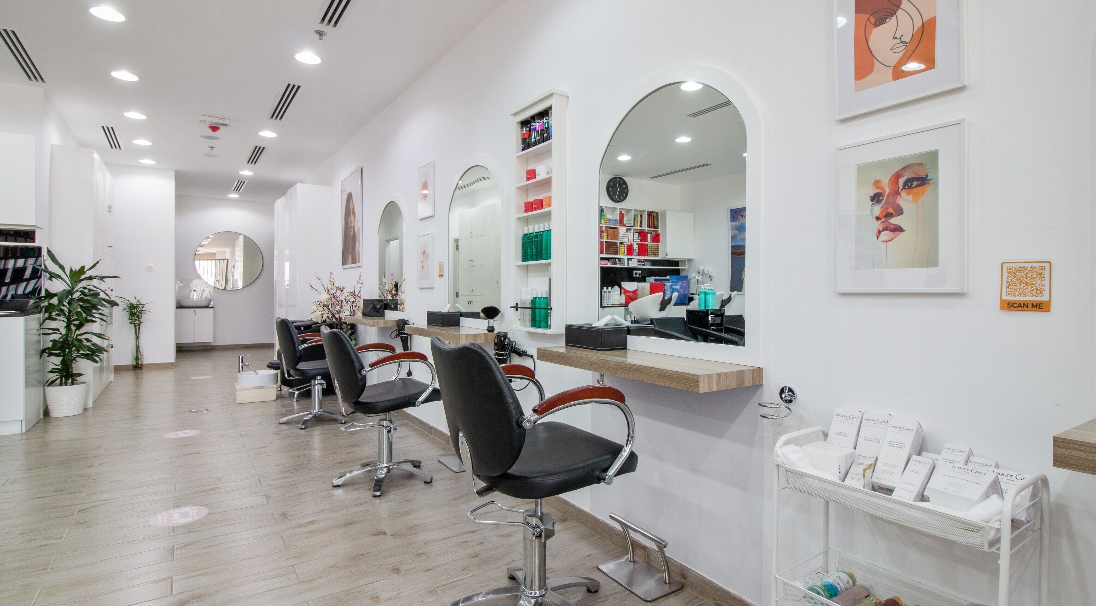 Modern interior of Salon Script in Dubai, AE featuring stylish salon chairs and elegant decor.