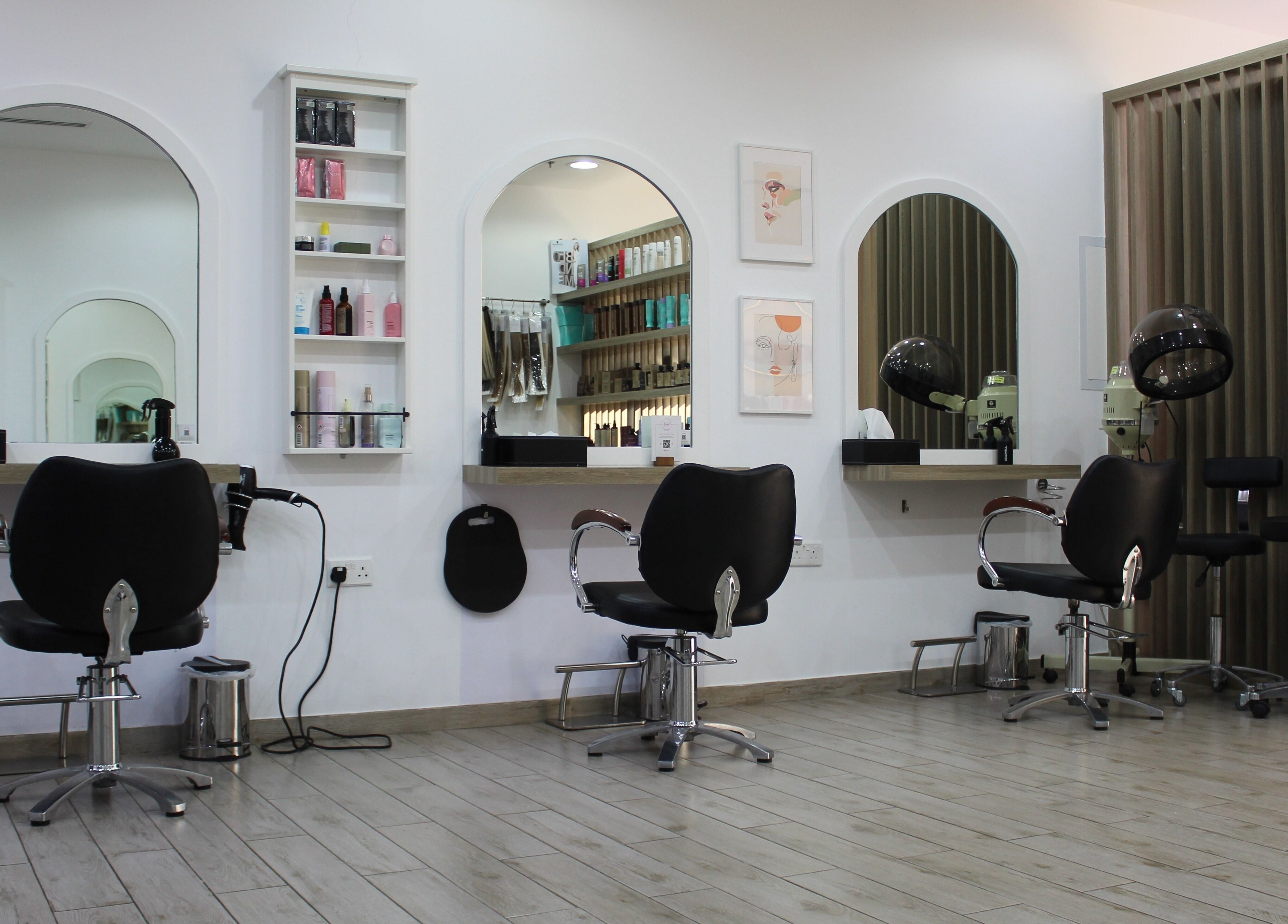 Modern salon interior at Salon Script in Dubai, AE with elegant mirrors and stylist chairs.