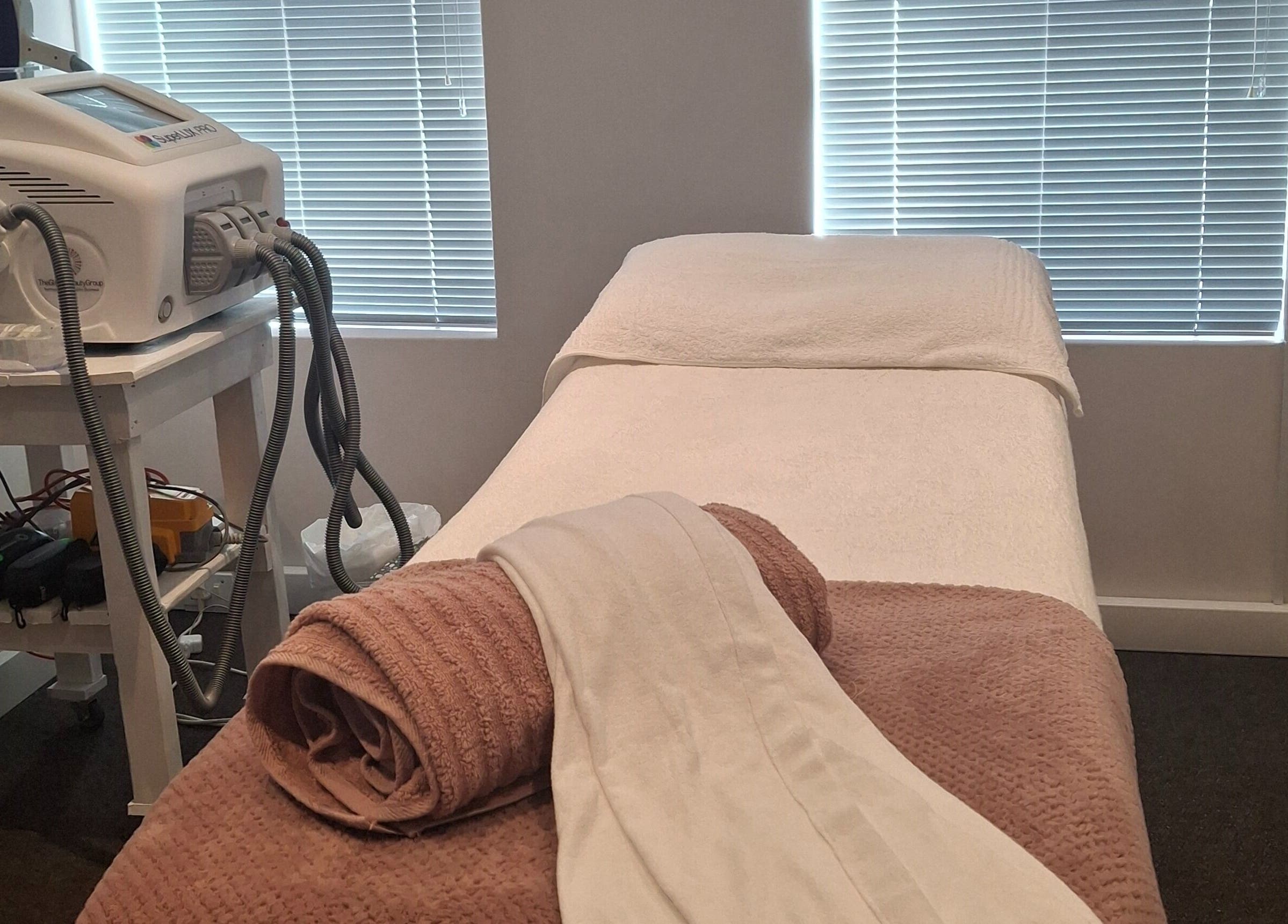 Treatment room at Go Bare Aesthetics and Skincare Clinic in Wellington, Western Cape, ZA featuring a modern setup.