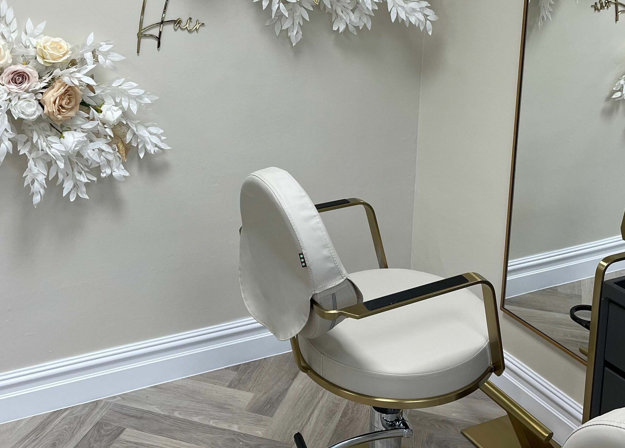 Stylish salon chair with floral decor at Bliss & Bloom Hair, Nether Poppleton, England, GB.