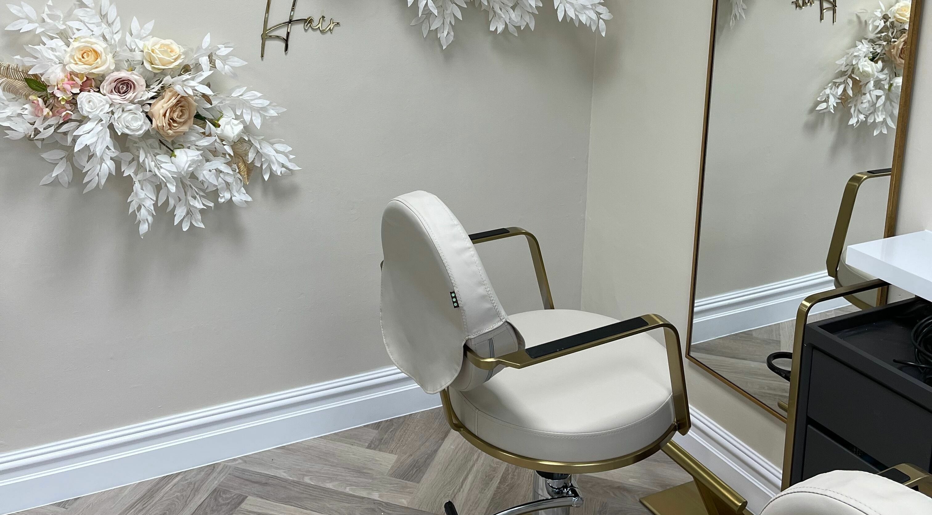 Stylish salon chair with floral decor at Bliss & Bloom Hair, Nether Poppleton, England, GB.