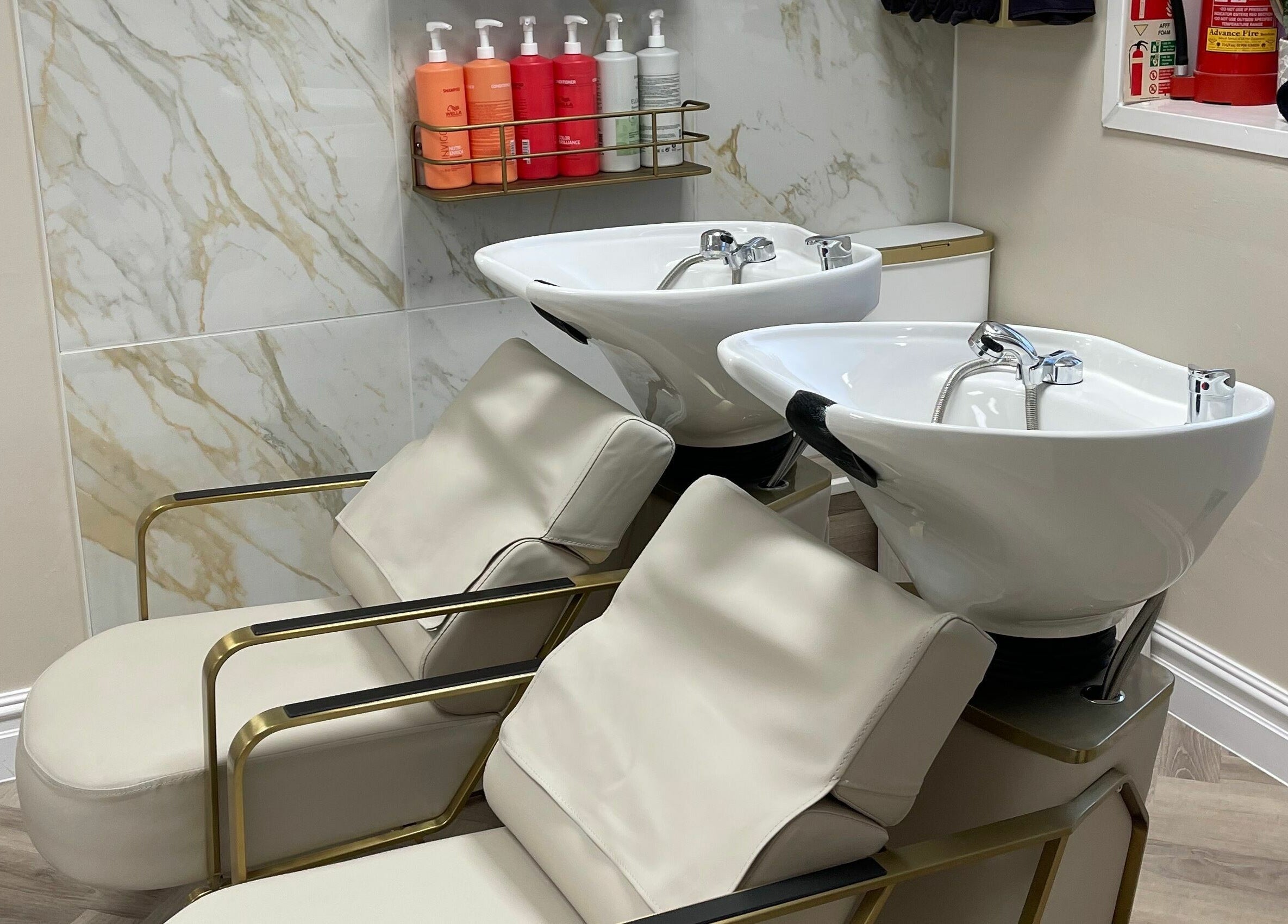 Luxurious hair wash stations at Bliss & Bloom Hair in Nether Poppleton, England, GB enhance relaxation.