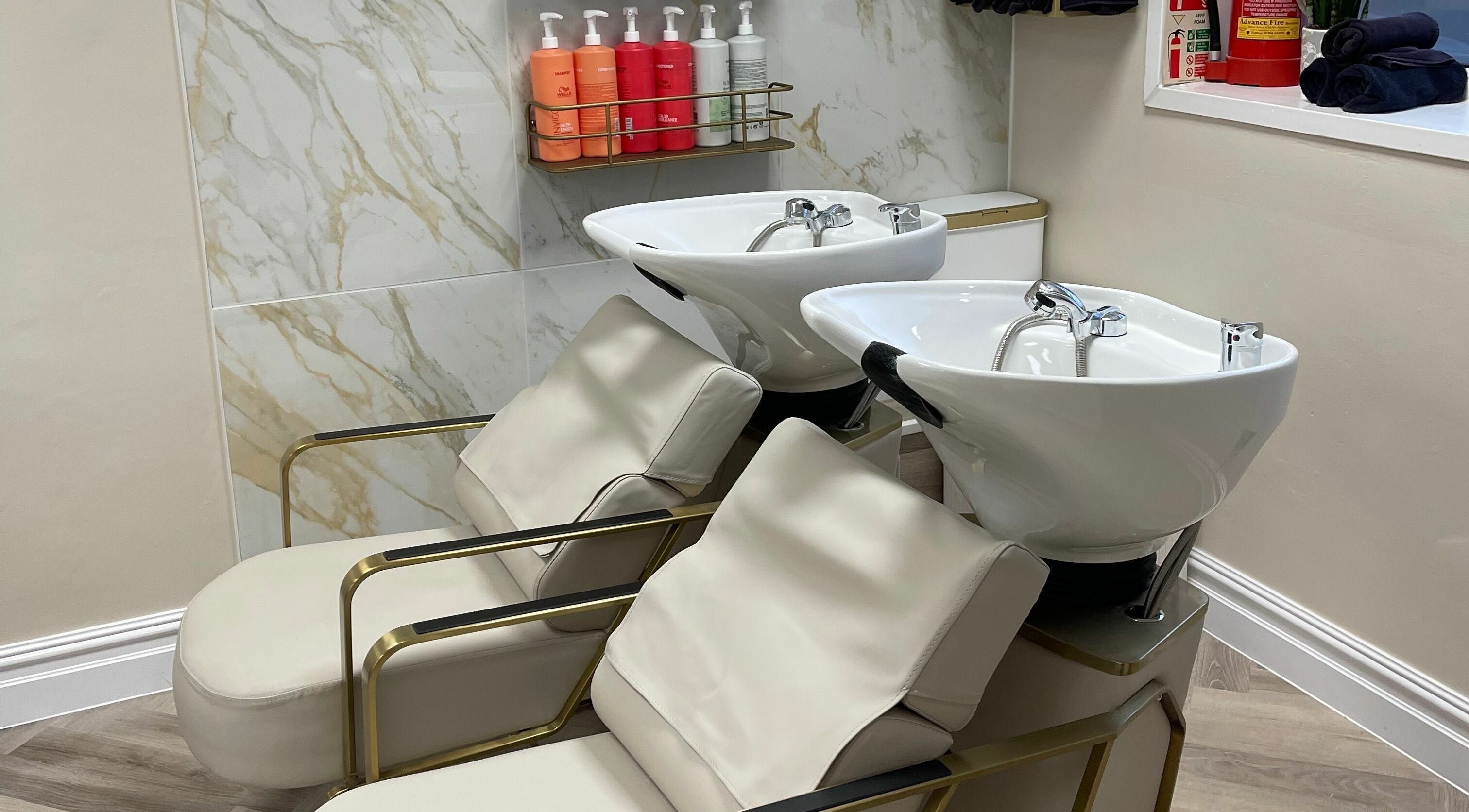Luxurious hair wash stations at Bliss & Bloom Hair in Nether Poppleton, England, GB enhance relaxation.