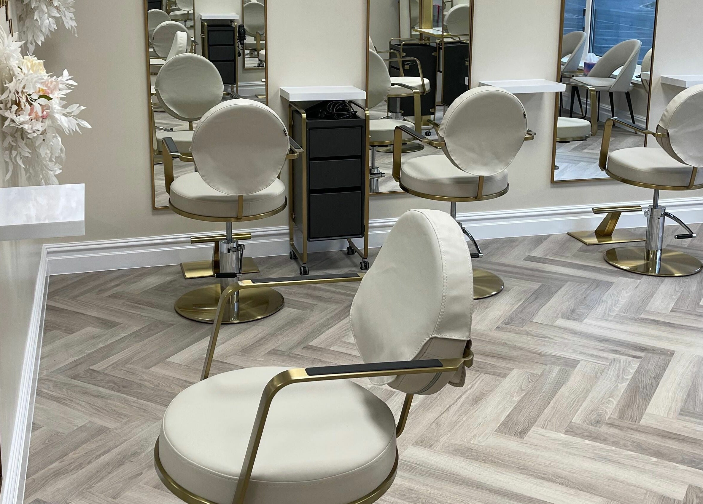 Elegant salon chairs at Bliss & Bloom Hair, Nether Poppleton, England, GB, offering comfort and style.