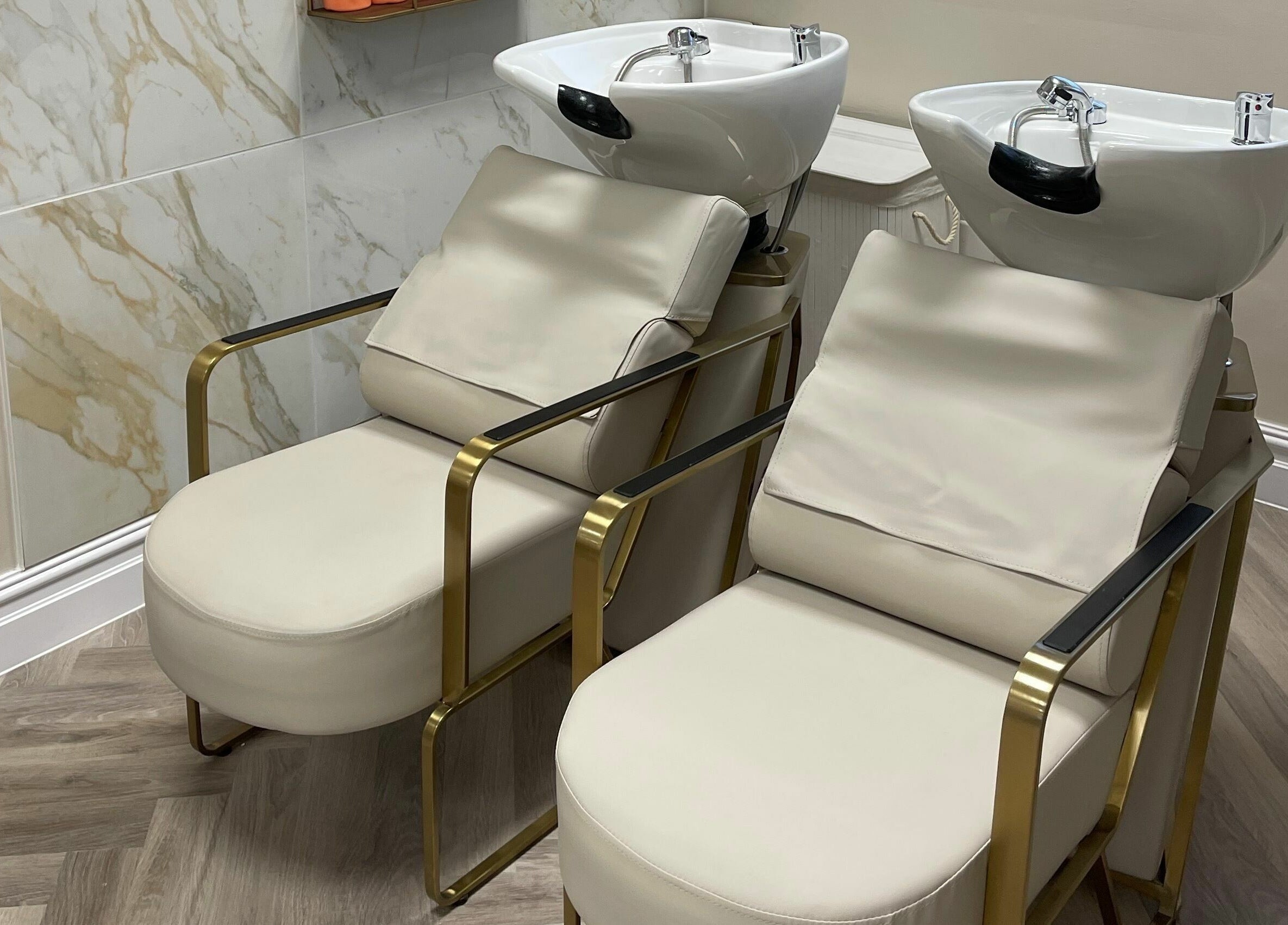 Luxurious wash stations at Bliss & Bloom Hair in Nether Poppleton, England, GB offer comfort and style.