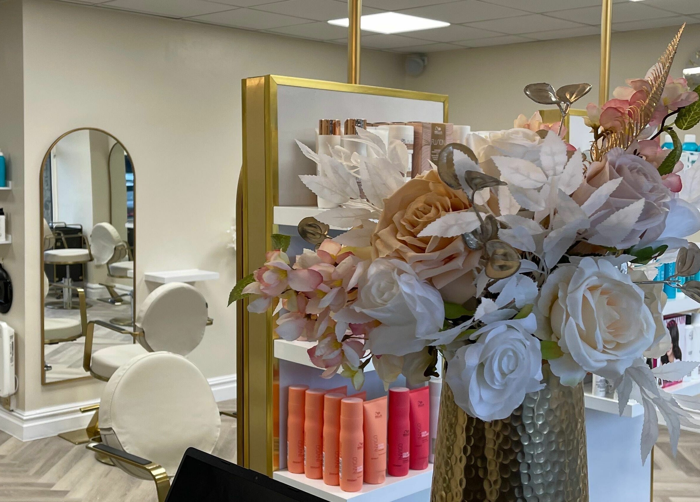 Floral arrangement and stylish mirrors at Bliss & Bloom Hair, Nether Poppleton, England, GB.