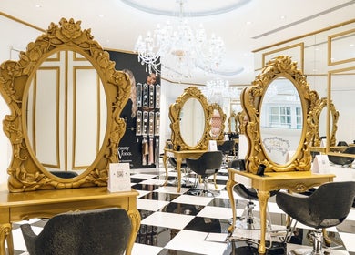 Elegant interior of Locks by Loulou Al Wasl, Dubai, AE featuring ornate mirrors and chic styling chairs.
