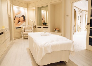 Elegant spa room at Locks by Loulou Al Wasl in Dubai, AE, featuring a massage bed and calming decor.