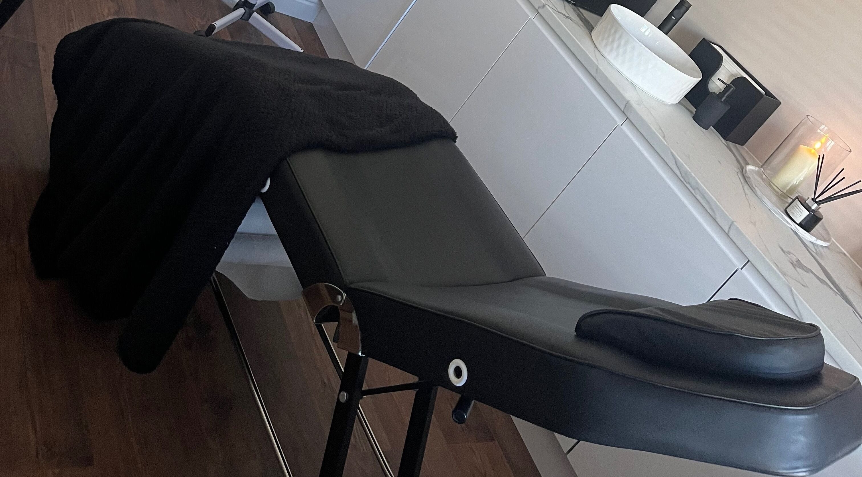 Luxurious treatment bed at Sam Jane The Salon in Lostock Hall, England, GB enhances relaxation and comfort.