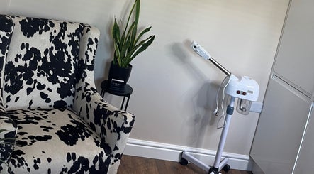 Stylish cow-print chair and steam machine at Sam Jane The Salon, Lostock Hall, England, GB.