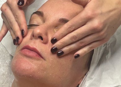 Facial massage at Sam Jane The Salon, Lostock Hall, England, GB, enhancing skin radiance and relaxation.