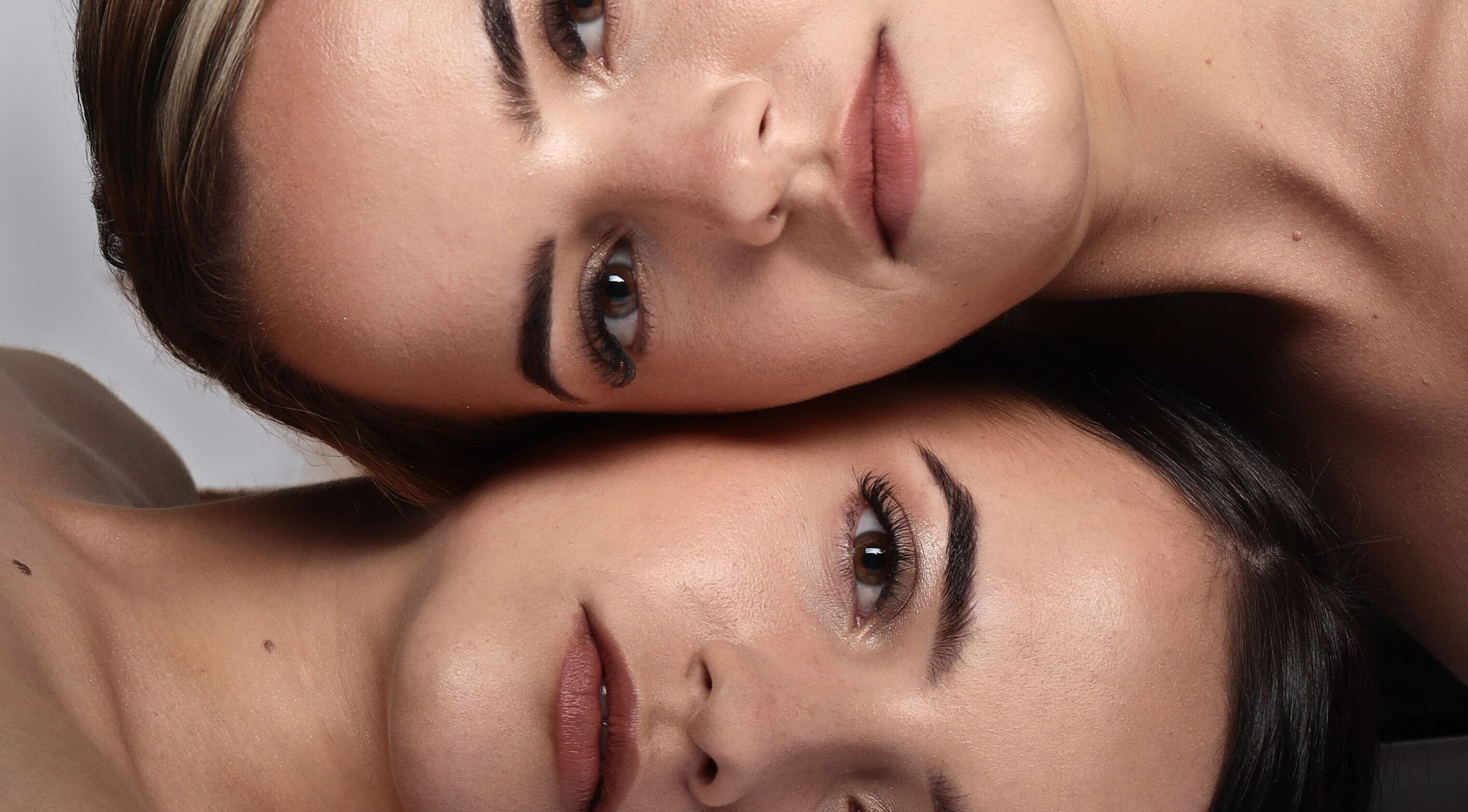 Close-up of two women with flawless makeup at Adapt Artistry, Randburg, Gauteng, ZA.