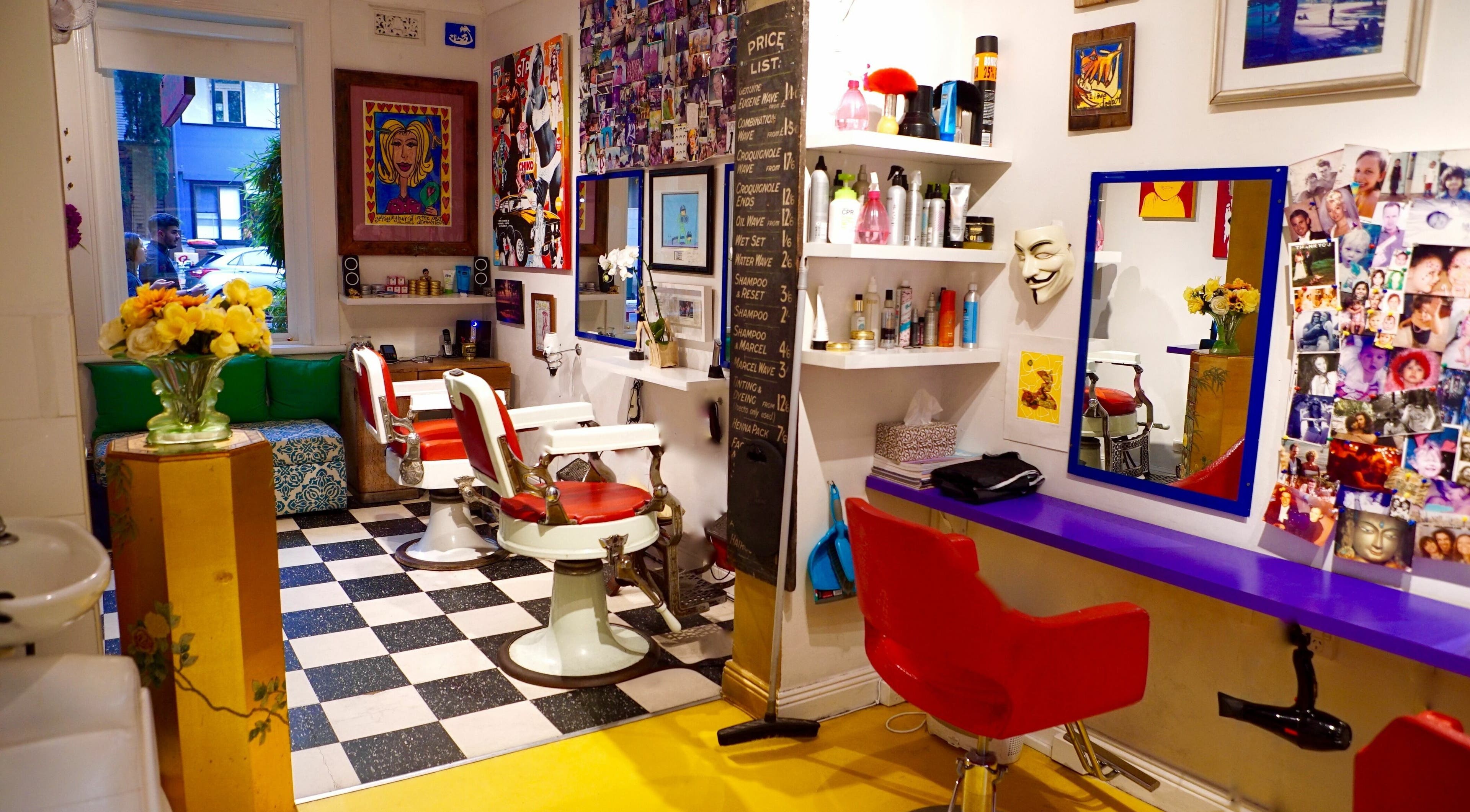 Charming interior of The Barberia - Surry Hills, featuring retro decor and styling chairs in Surry Hills, New South Wales, AU.