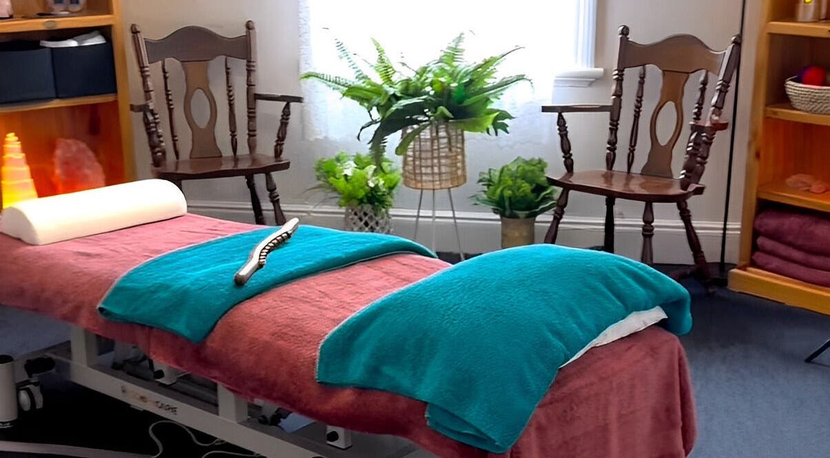 Tranquil massage room at Macks Massage in Albany, Western Australia, AU, featuring cozy chairs and greenery.